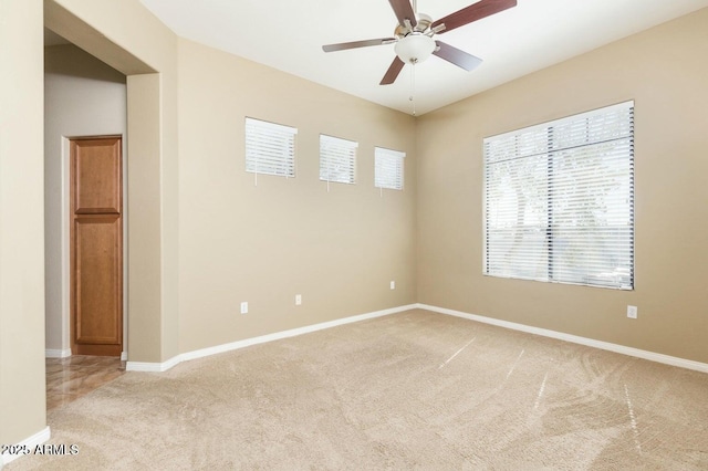 2989 N 44th St N Unit 2007, Phoenix, AZ 85018 - empty room featuring light colored carpet, ceiling fan, and baseboards