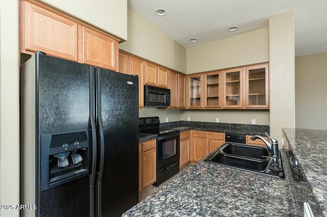 2989 N 44th St N Unit 2007, Phoenix, AZ 85018 - kitchen with black appliances, a sink, glass insert cabinets, and recessed lighting