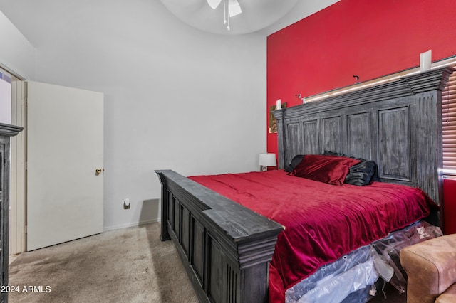 bedroom featuring ceiling fan and carpet