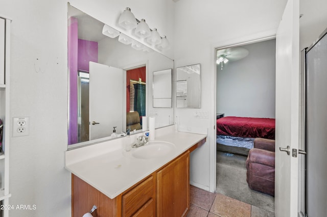 bathroom featuring vanity, ceiling fan, tile patterned floors, and walk in shower