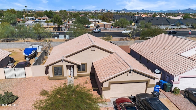 birds eye view of property featuring a mountain view