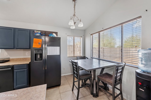 kitchen with dishwasher, stainless steel fridge, vaulted ceiling, pendant lighting, and light tile patterned floors