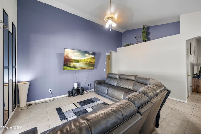 tiled living room with ceiling fan