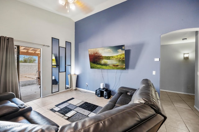 living room featuring light tile patterned flooring, high vaulted ceiling, and ceiling fan