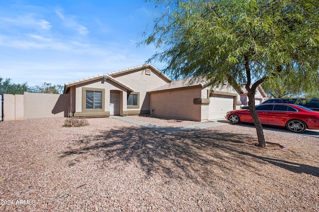 ranch-style home featuring a garage