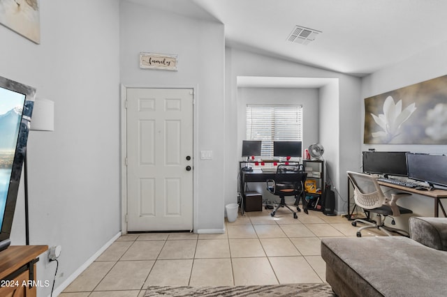 tiled home office featuring vaulted ceiling