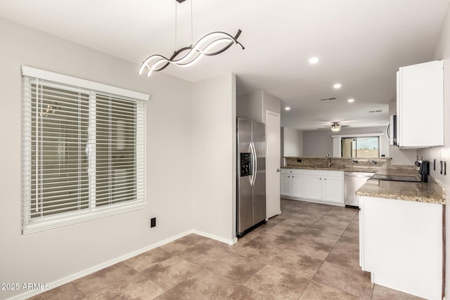 kitchen featuring visible vents, recessed lighting, a sink, stainless steel appliances, and white cabinetry