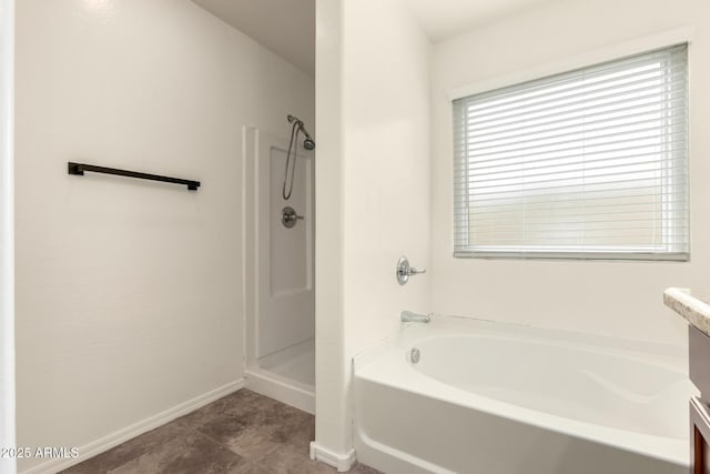 full bath featuring vanity, baseboards, tile patterned flooring, walk in shower, and a garden tub