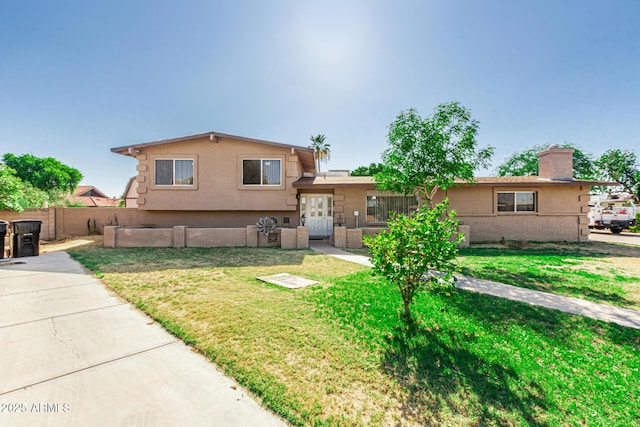 840 N Acacia, Mesa, AZ 85213 - view of front of house featuring stucco siding and a chimney