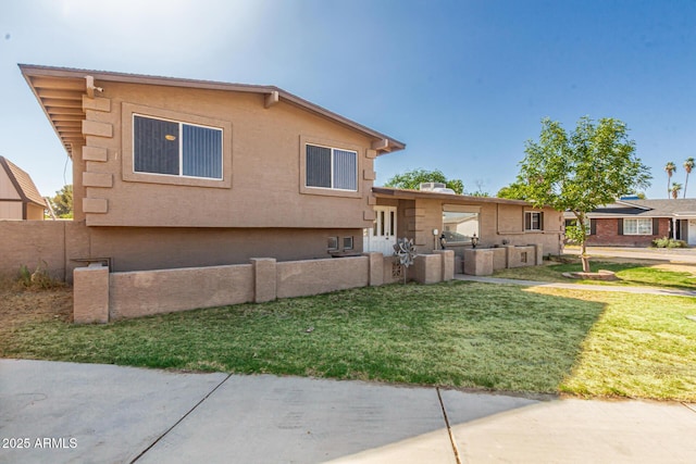 840 N Acacia, Mesa, AZ 85213 - split level home featuring a front lawn and stucco siding