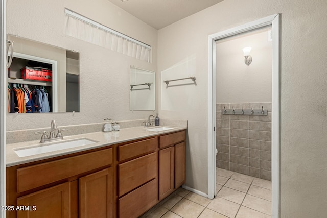 840 N Acacia, Mesa, AZ 85213 - bathroom featuring tile patterned flooring, double vanity, and a walk in closet