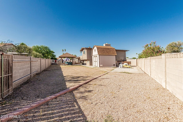 840 N Acacia, Mesa, AZ 85213 - rear view of house featuring a gazebo, a fenced backyard, a storage shed, and a patio