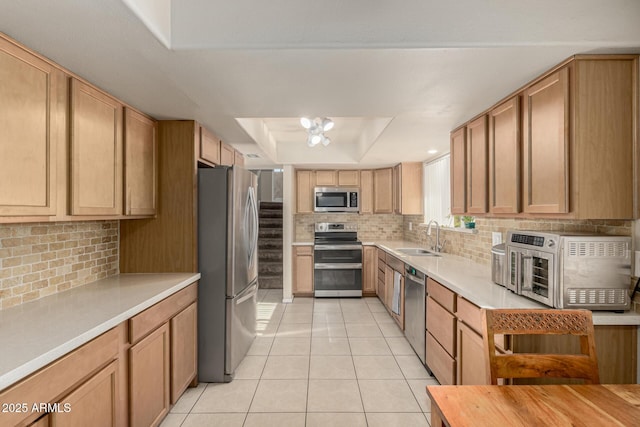 840 N Acacia, Mesa, AZ 85213 - kitchen with appliances with stainless steel finishes, a tray ceiling, backsplash, and light tile patterned flooring