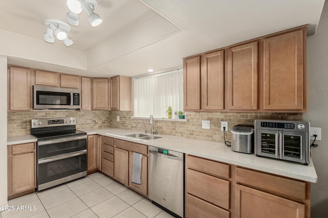 840 N Acacia, Mesa, AZ 85213 - kitchen featuring stainless steel appliances, tasteful backsplash, light countertops, and light tile patterned floors
