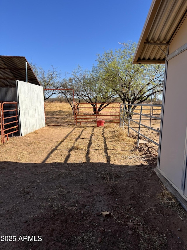 view of yard featuring an exterior structure and an outbuilding