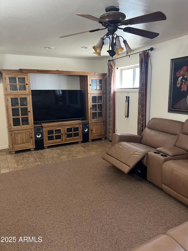 living area with a ceiling fan