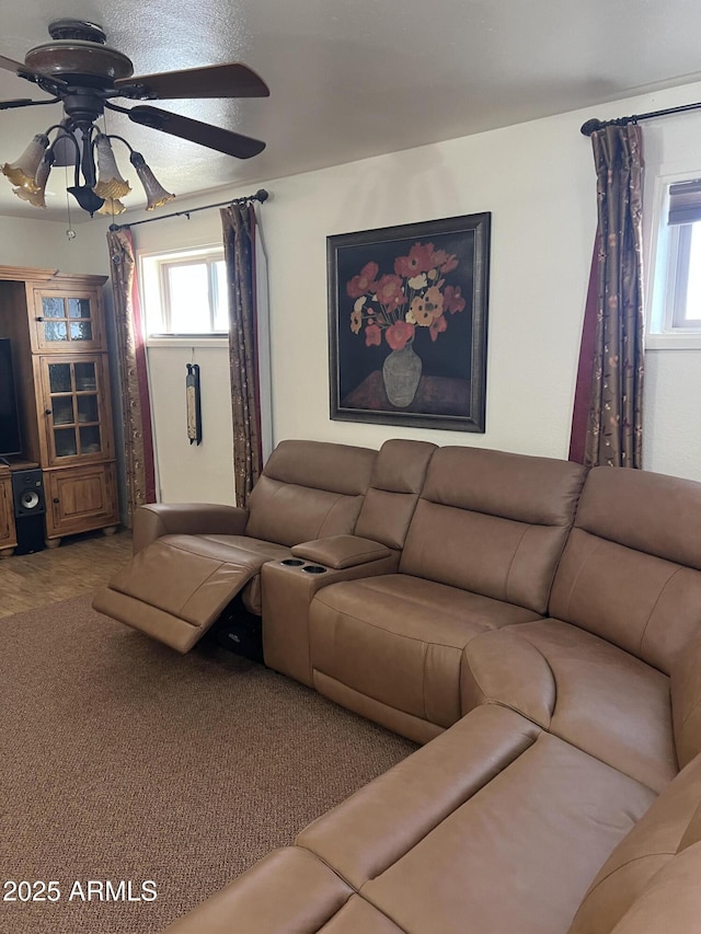 living room featuring carpet floors and ceiling fan