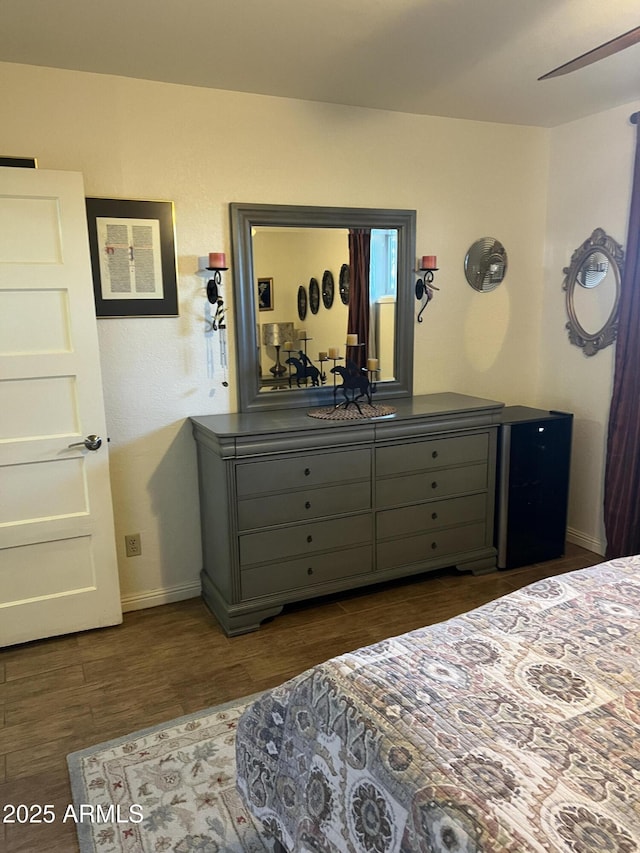 bedroom featuring baseboards and wood finished floors