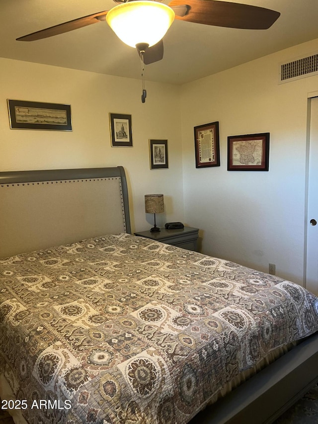 bedroom with ceiling fan and visible vents