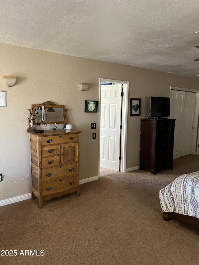 carpeted bedroom with baseboards