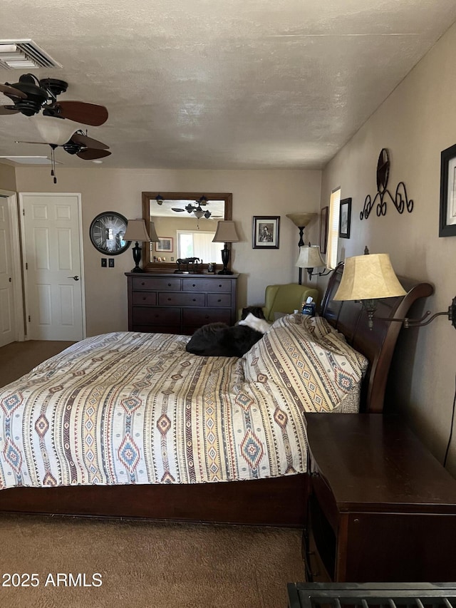 carpeted bedroom featuring visible vents