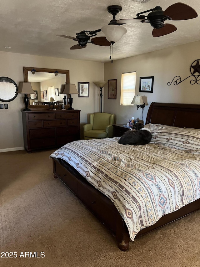 bedroom featuring carpet floors, a ceiling fan, and baseboards