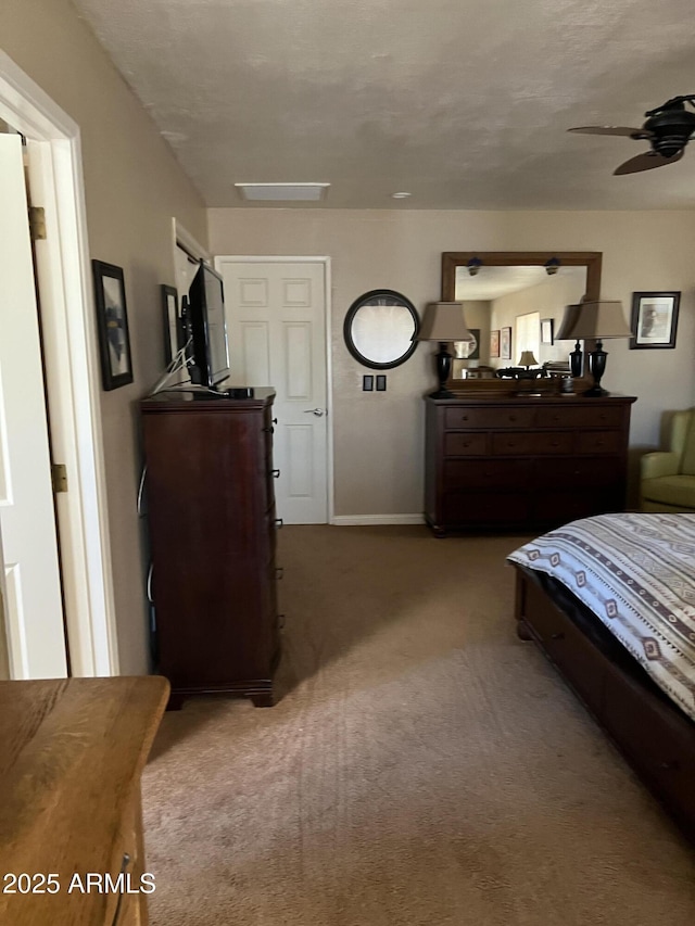 bedroom with carpet floors and baseboards