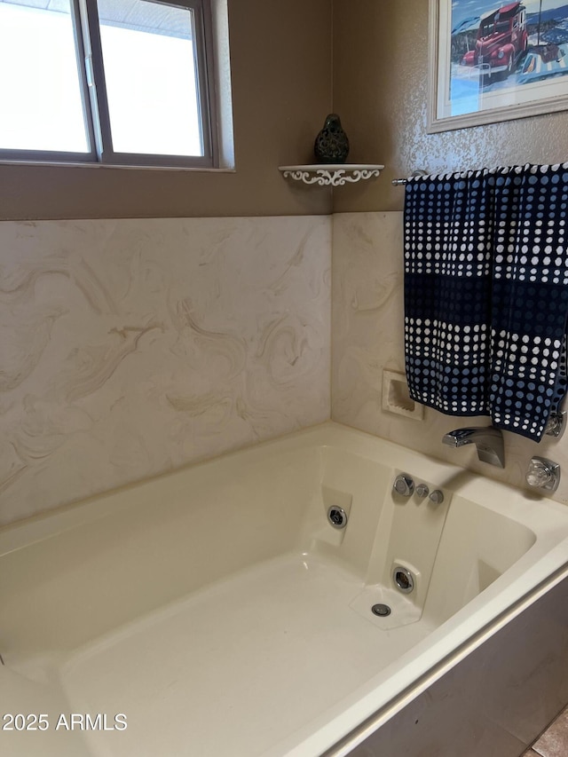 full bathroom with a bath