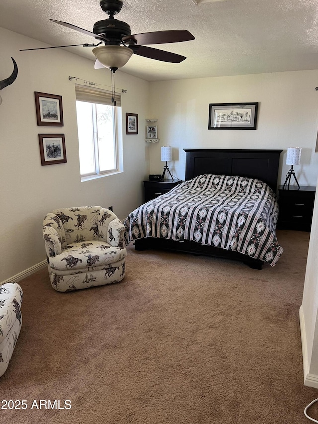 bedroom with baseboards, carpet flooring, a textured ceiling, and a ceiling fan
