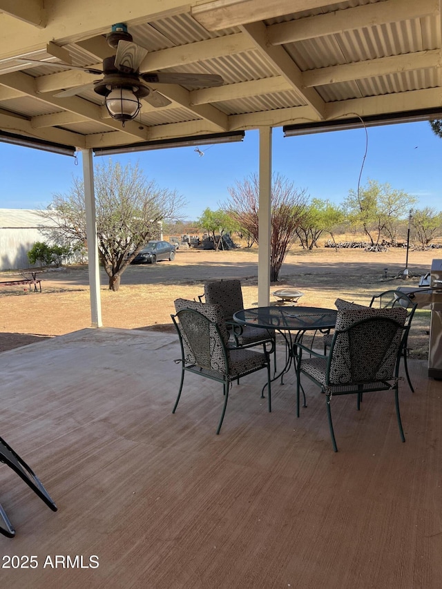 view of patio / terrace with outdoor dining area and ceiling fan