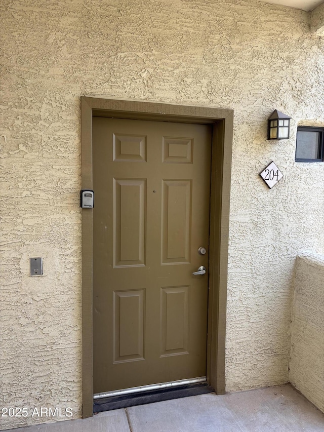3434 E Baseline Rd Unit 204, Phoenix, AZ 85042 - property entrance with stucco siding