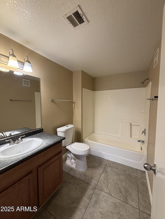 3434 E Baseline Rd Unit 204, Phoenix, AZ 85042 - full bath with vanity, tub / shower combination, a textured ceiling, tile patterned flooring, and a textured wall