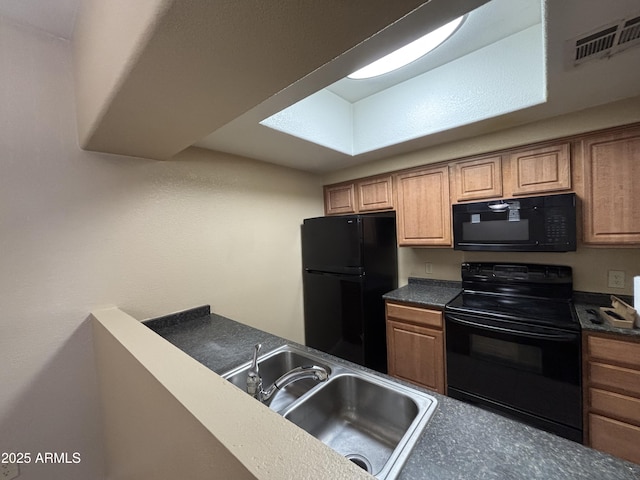 3434 E Baseline Rd Unit 204, Phoenix, AZ 85042 - kitchen featuring black appliances, dark countertops, and brown cabinets