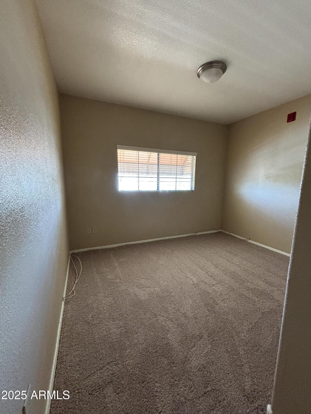 3434 E Baseline Rd Unit 204, Phoenix, AZ 85042 - carpeted empty room featuring baseboards