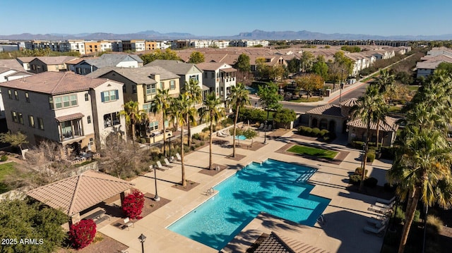 view of pool with a patio area and a mountain view