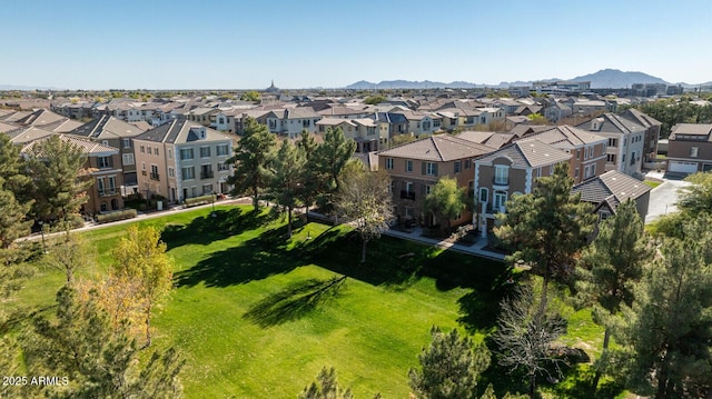 birds eye view of property featuring a mountain view