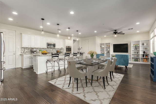 dining room with recessed lighting, a ceiling fan, and dark wood-style flooring