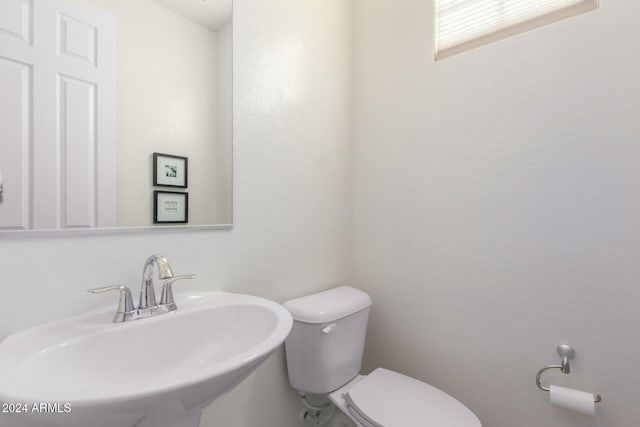 bathroom featuring a sink and toilet