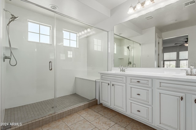 bathroom featuring tile patterned flooring, vanity, an enclosed shower, and ceiling fan