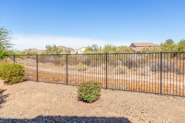 view of gate featuring a mountain view