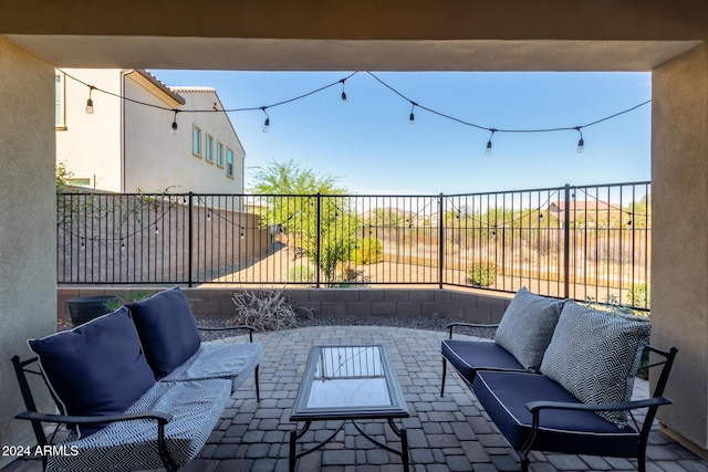 view of patio featuring an outdoor living space and a fenced backyard
