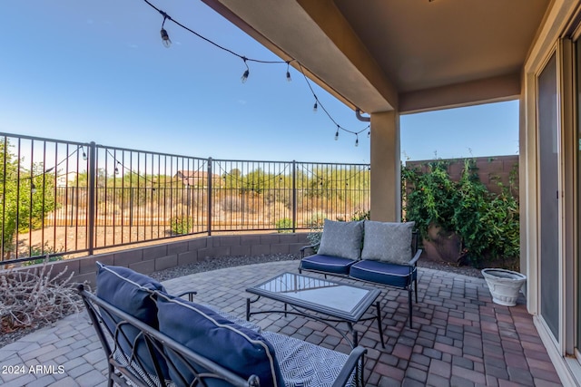 view of patio / terrace featuring an outdoor living space and a fenced backyard