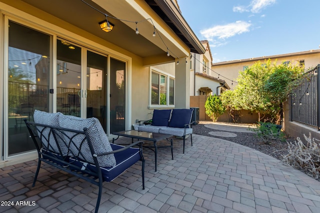 view of patio / terrace with fence and an outdoor living space