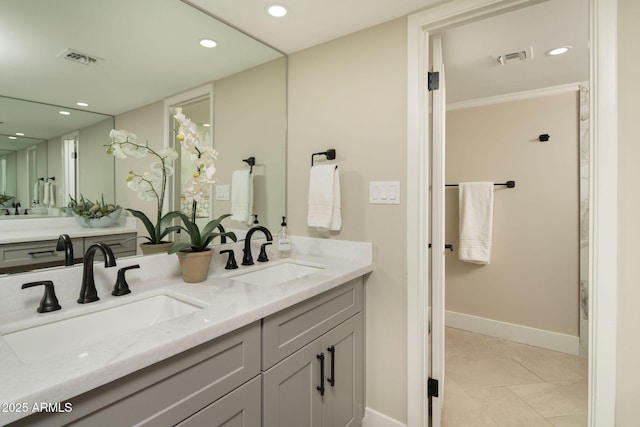 bathroom featuring tile patterned flooring and vanity