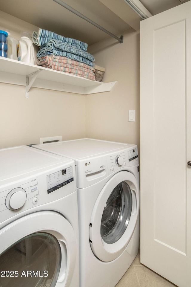 laundry room featuring washing machine and clothes dryer