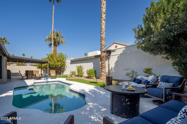 view of swimming pool with an outdoor living space and a patio area