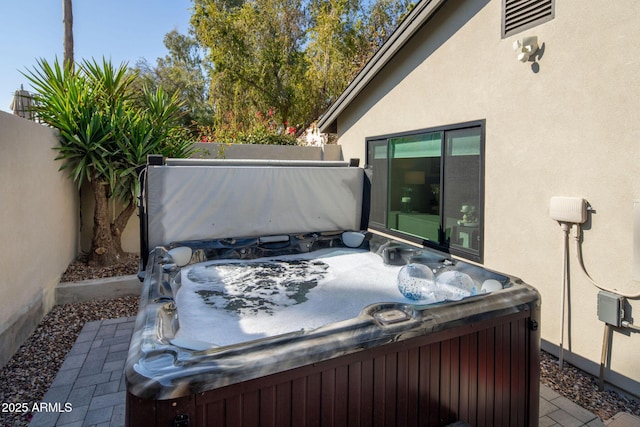 view of patio / terrace featuring a hot tub