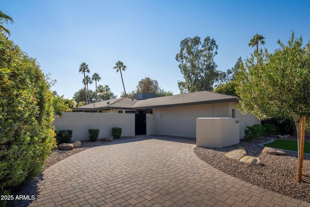 view of front of property featuring a garage