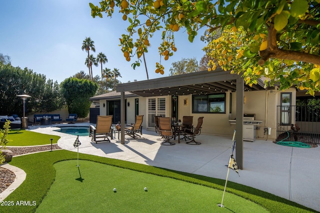 rear view of property with a pergola and a patio area