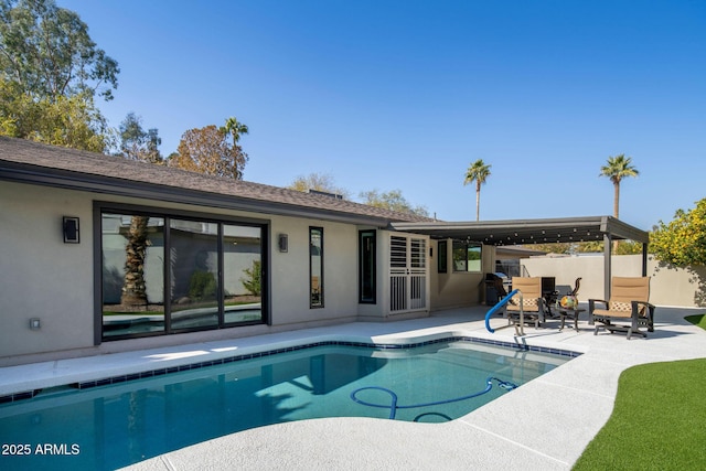 view of swimming pool featuring a patio